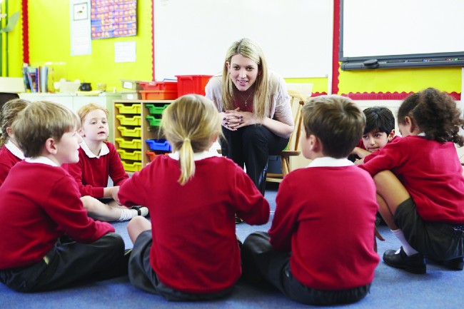 Teacher with group of young children